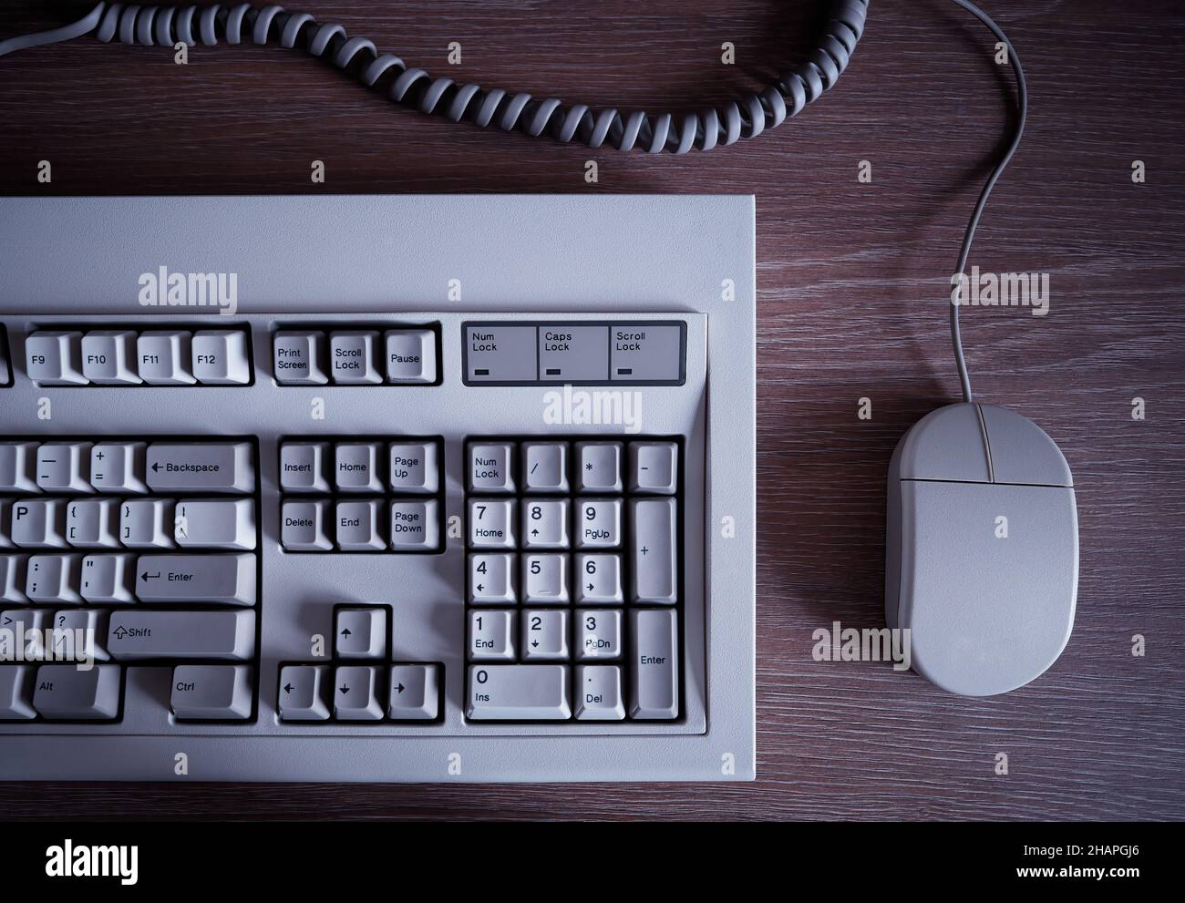 Vintage computer keyboard and mouse background Stock Photo