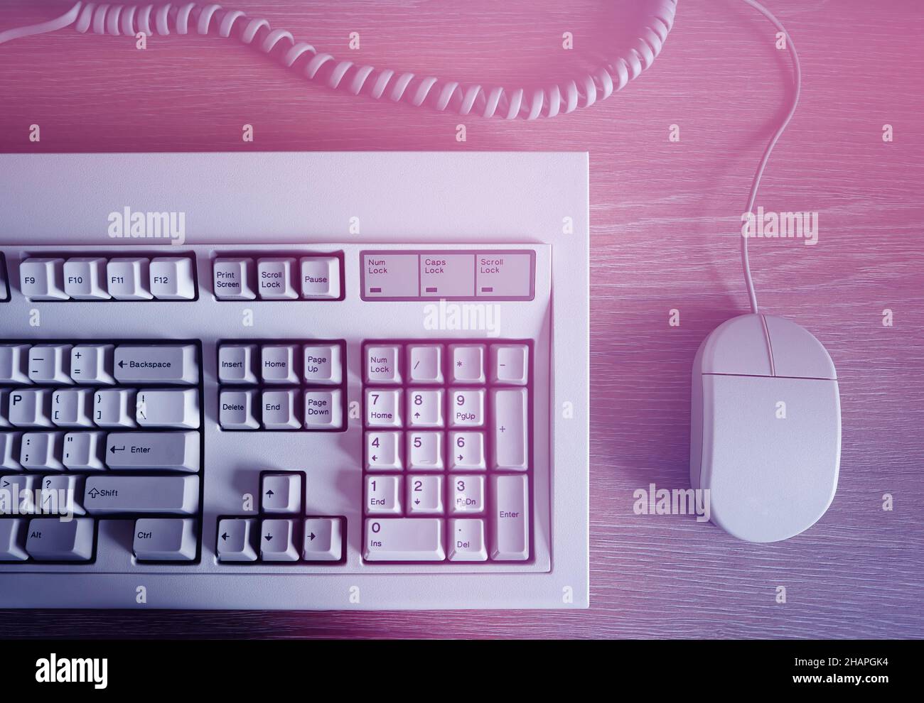 Retro computer keyboard& mouse in light leak Stock Photo