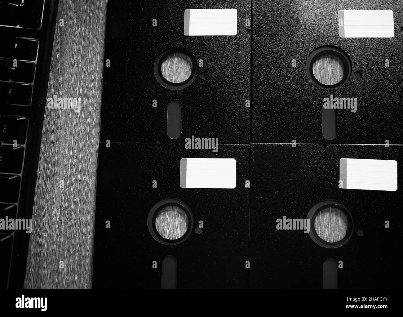 Four floppy disks 5.25 inch vintage computer storage background Stock Photo