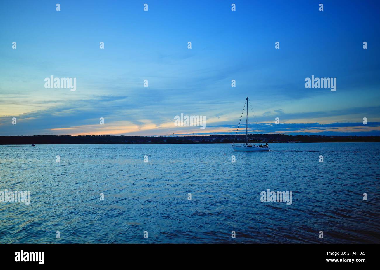 Boat on sunset river background Stock Photo - Alamy