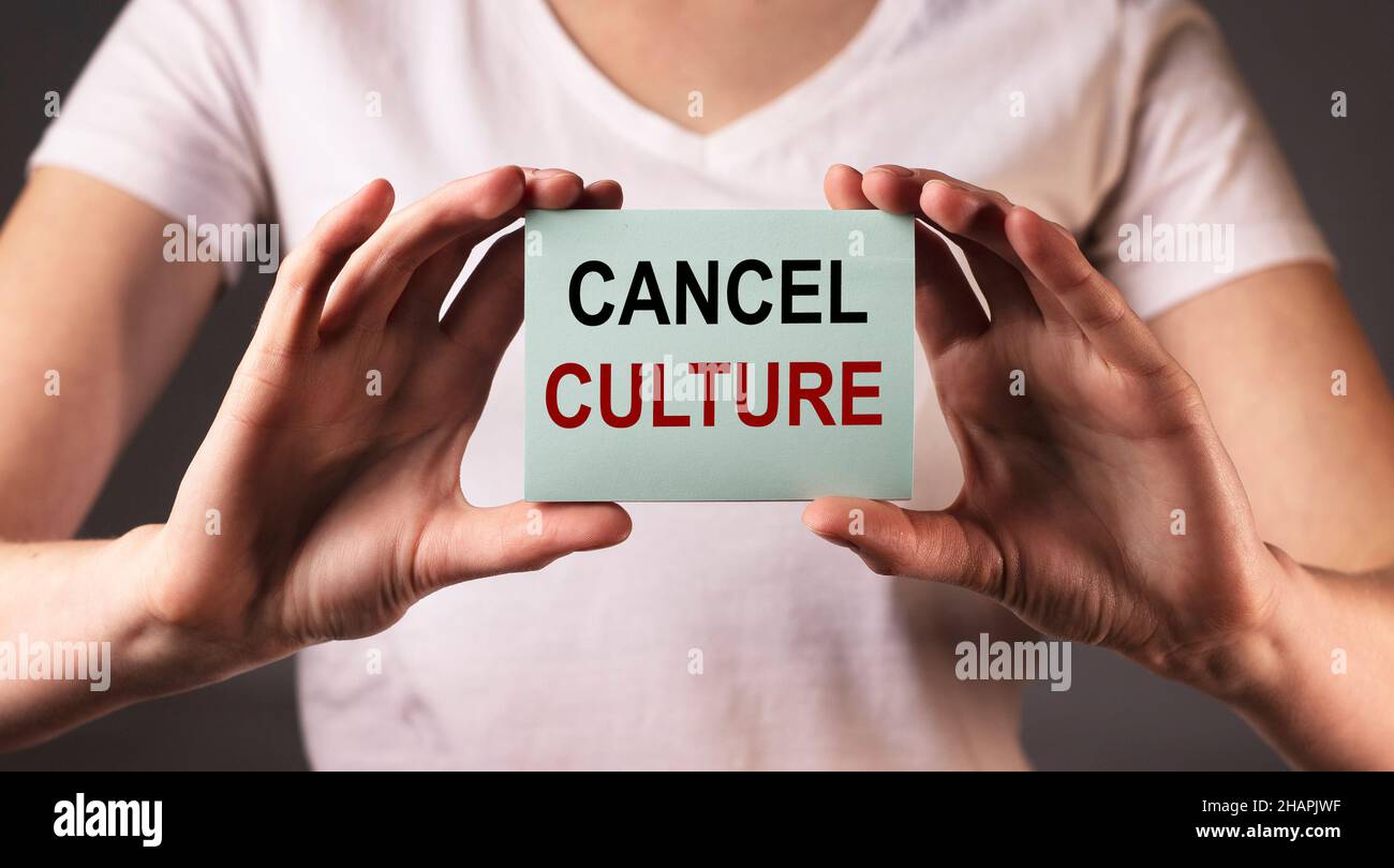 Cancel culture concept. Word in female hands. Stock Photo