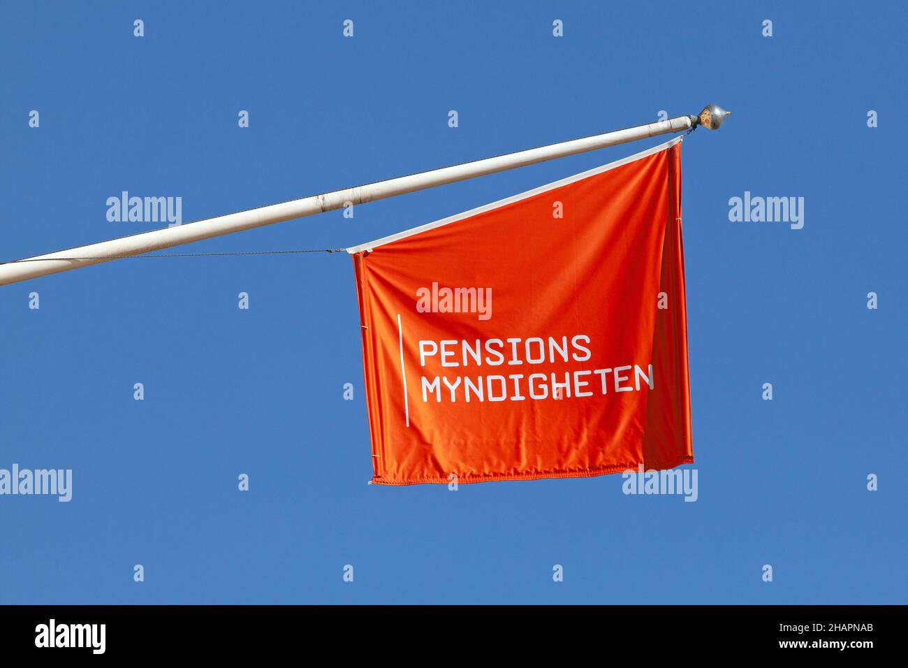 Stockholm, Sweden - March 25, 2021: A flag with the logo of The Swedish Pensions Agency that manage the Swedish citizens pension payments and plans. Stock Photo