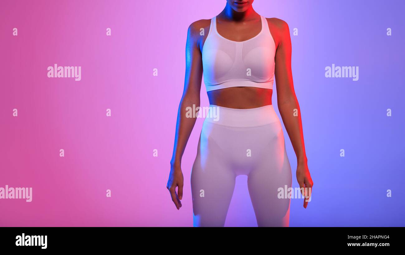 Fitness Woman With Lean Body Standing Over Neon Background, Cropped ...