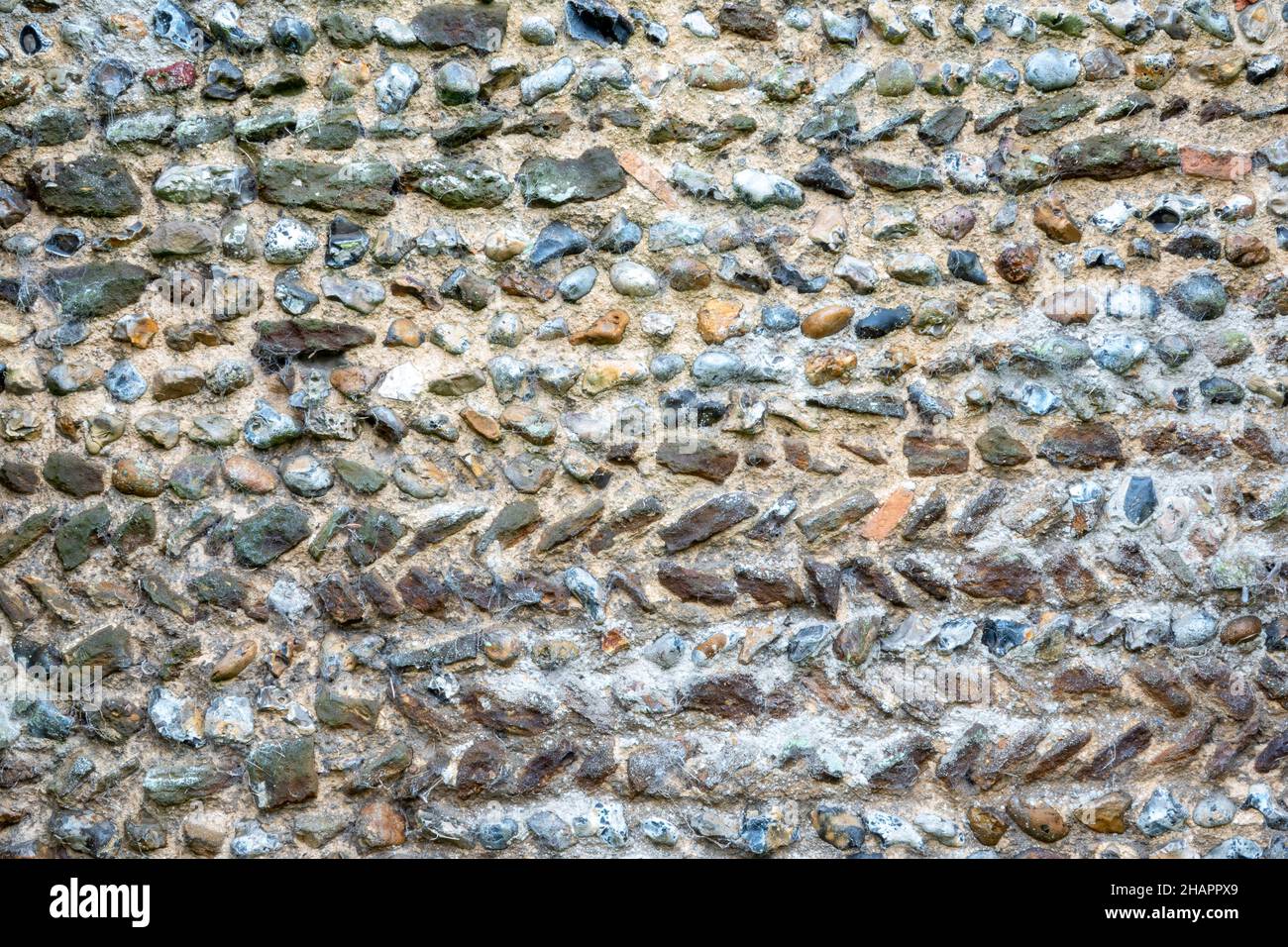 A section of the exterior of the north wall, believed to be early 11th century, of St Mary of the Assumption, Ufford, Suffolk Stock Photo