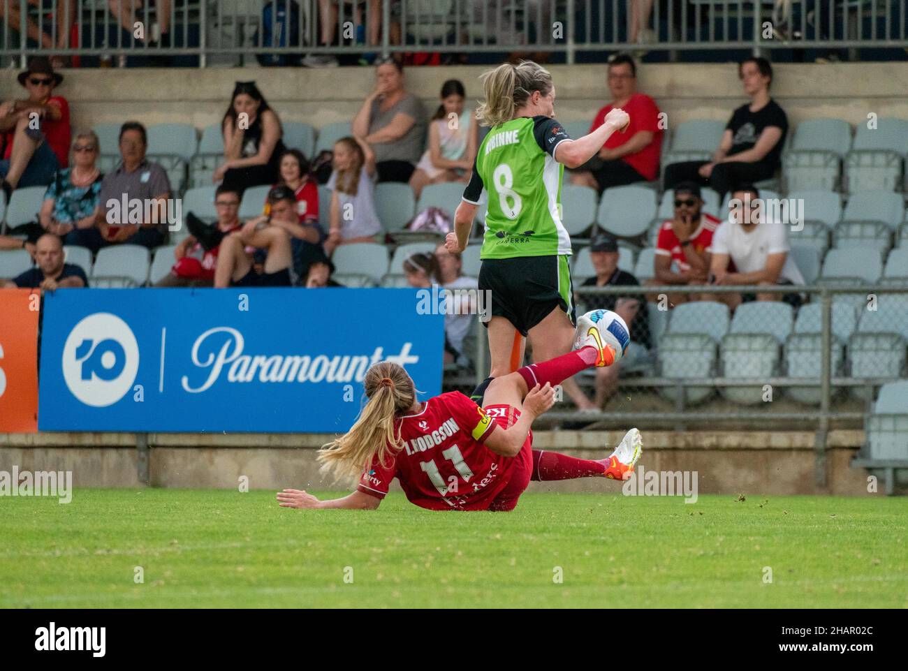 Adelaide, Australia. 12th Dec, 2021. Adelaide, South Australia, Decem Margot Robinne (8 Canberra) is tackled by Isabel Hodgson (11 Adelaide) during the Liberty A-League game between Adelaide United and Canberra United in Adelaide, Australia. Noe Llamas/SPP Credit: SPP Sport Press Photo. /Alamy Live News Stock Photo