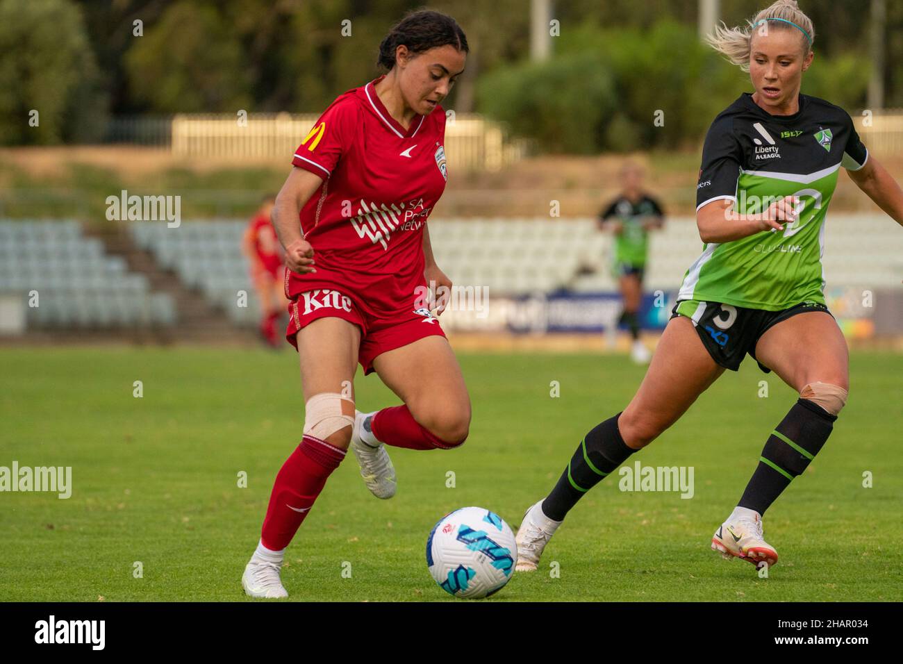 Adelaide, Australia. 12th Dec, 2021. Adelaide, South Australia, Decem Emilia Murray (22 Adelaide) closely defended by Lauren Keir (5 Canberra) during the Liberty A-League game between Adelaide United and Canberra United in Adelaide, Australia. Noe Llamas/SPP Credit: SPP Sport Press Photo. /Alamy Live News Stock Photo