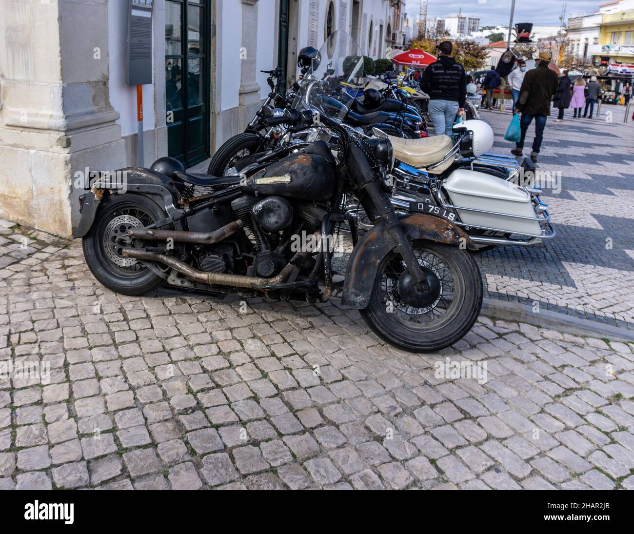 A Harley Davison motorbike looking in need of repair.Often referred to as rat bikes, maintained at low cost or styled to look like a rat bike Stock Photo