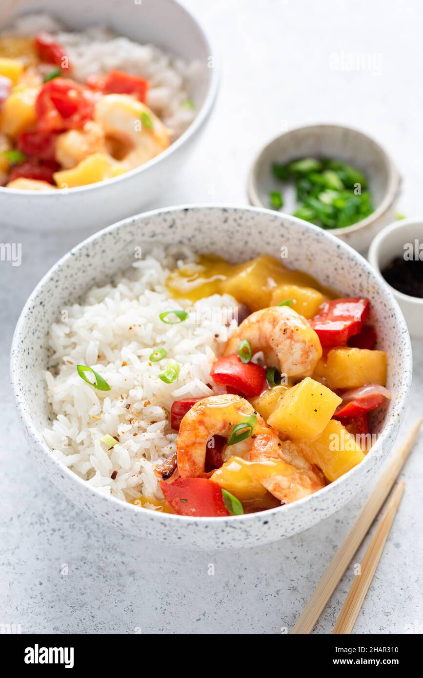 White rice with shrimps and pineapple curry. Asian cuisine food, closeup view Stock Photo