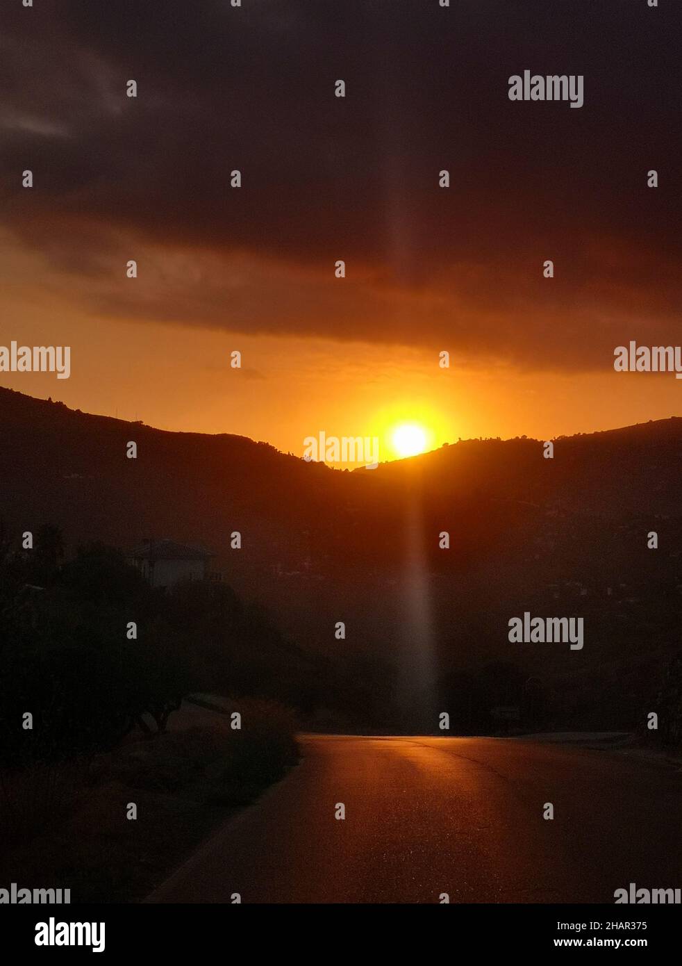 Sunset over a mountain road near Frigiliana in Málaga Province, Andalucia, Spain. Stock Photo