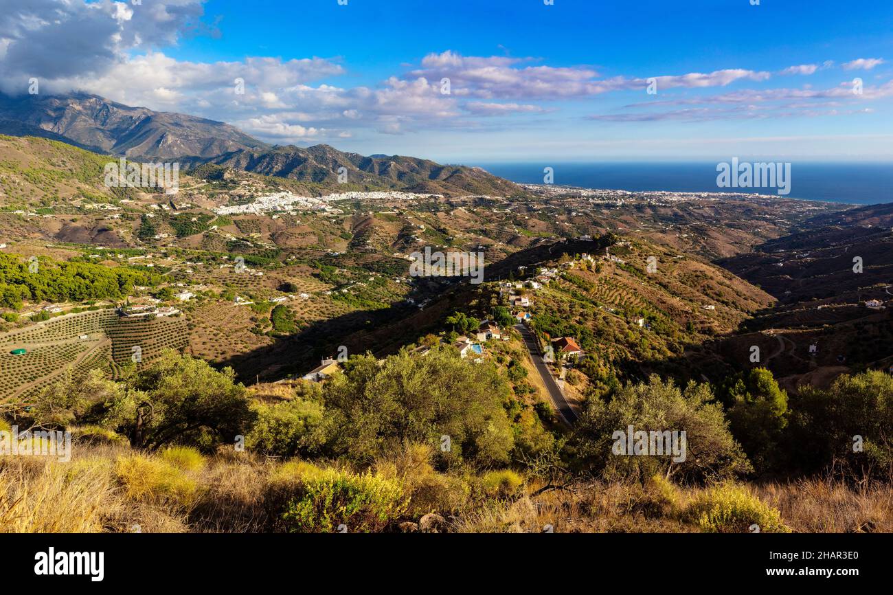 The landscape illustrating the camp (countryside) around Frigiliana and the distant coastal town of Nerja, Malaga Province, Andalucia, Spain Stock Photo