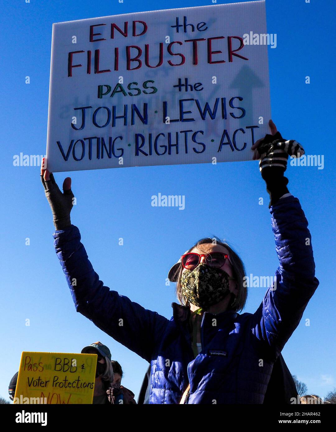 December 13, 2021, Washington, District of Columbia, USA: A participant at the Poor People's Campaign rally holds a sign demanding Congress end the filibuster and pass the John Lewis Voting Rights Act. (Credit Image: © Sue Dorfman/ZUMA Press Wire) Stock Photo