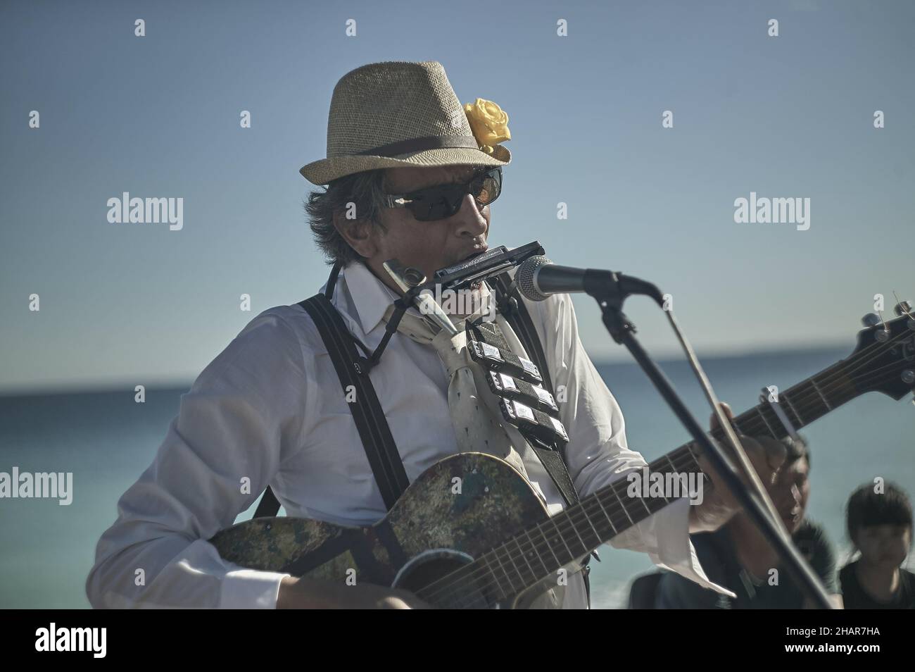 NICE, FRANCE Jan 01, 2001 Harmonica player street artist in Nice