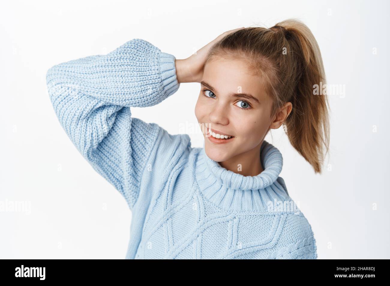 Close up portrait of beautifu teen girl, child posing in ponytail