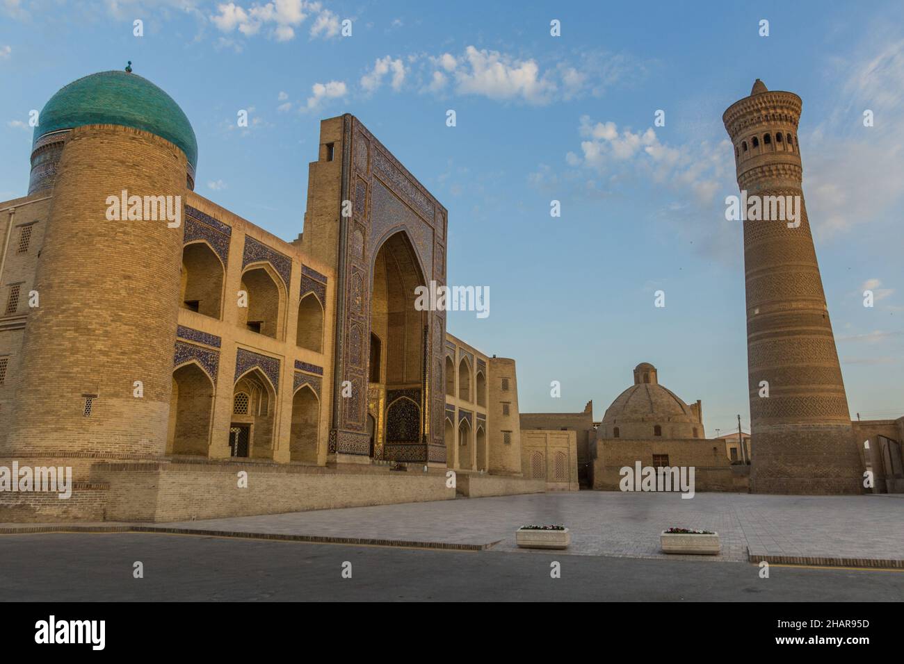BUKHARA, UZBEKISTAN - APRIL 30, 2018: Mir-i-Arab Madrasa and Kalan minaret in Bukhara, Uzbekistan Stock Photo