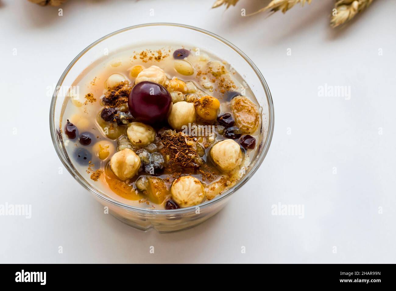 Traditional dessert Noah's Pudding,Ashure in transparent glass bowl on ...