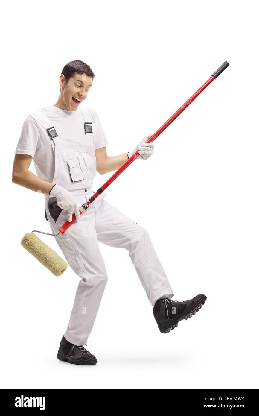 Full length portrait of a cheerful house painter playing guitars with a