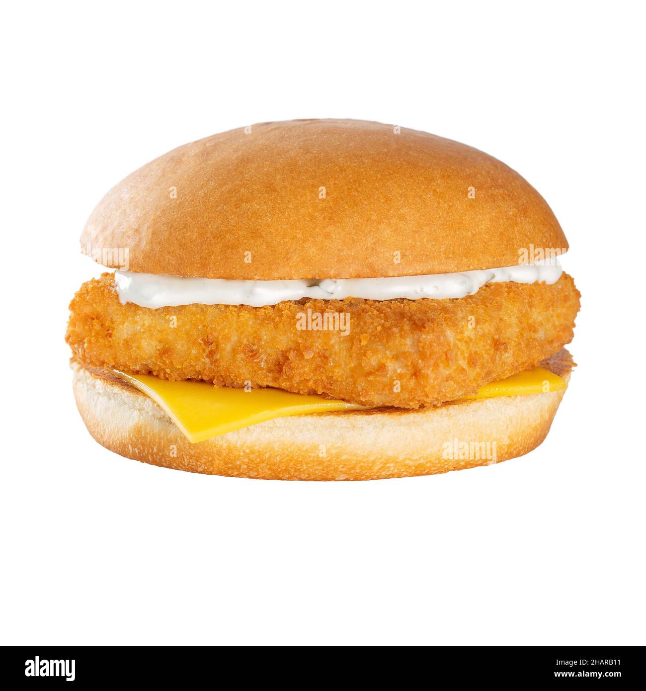 Fish burger with white sauce and cheddar cheese. Stock Photo