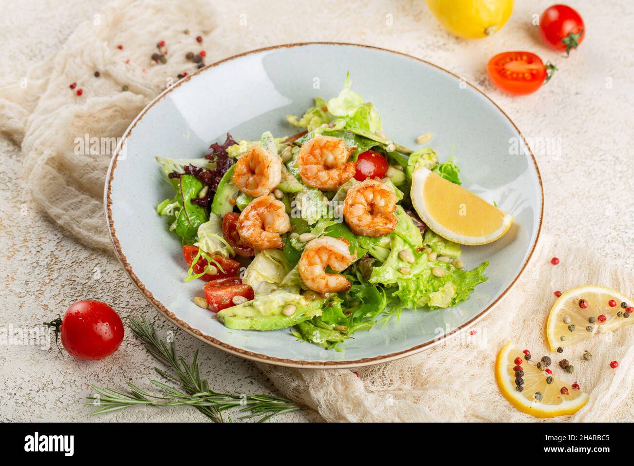 Shrimp, avocado and cherry tomato salad. Stock Photo