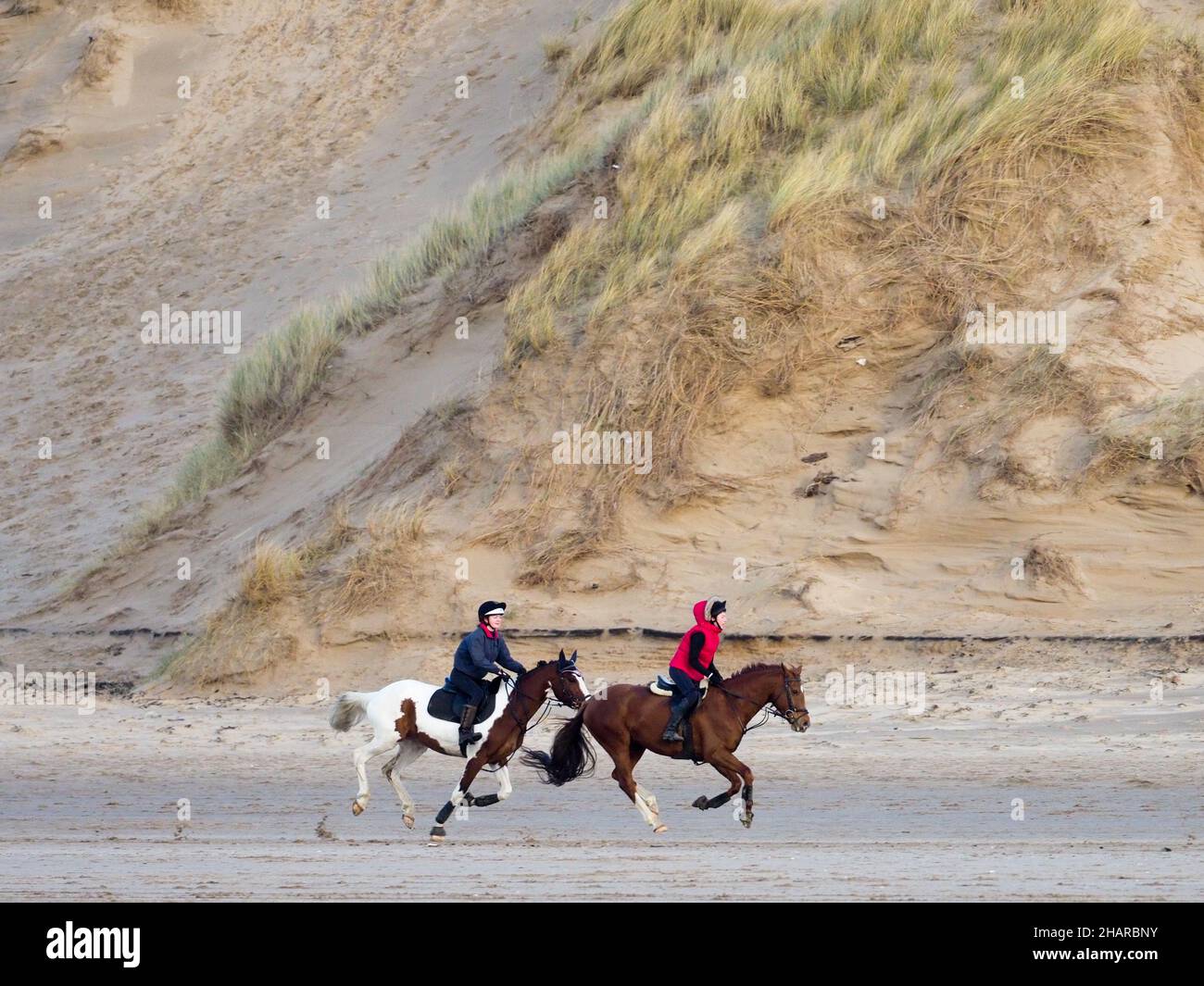 Horse riding on Formby Beach Stock Photo Alamy