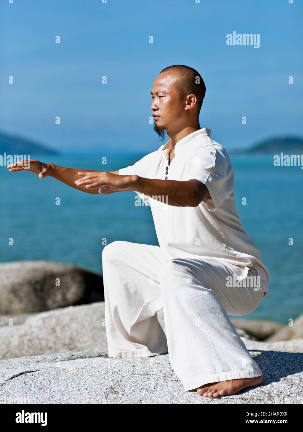 Man Practices Qi Gong at Kamalaya, Koh Samui, Thailand. Qi Gong Master