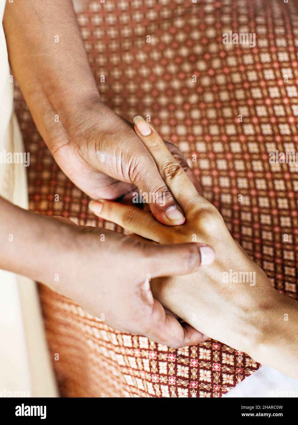 Woman Receiving Marma Point Therapy at Kamalaya, Koh Samui, Thailand. A