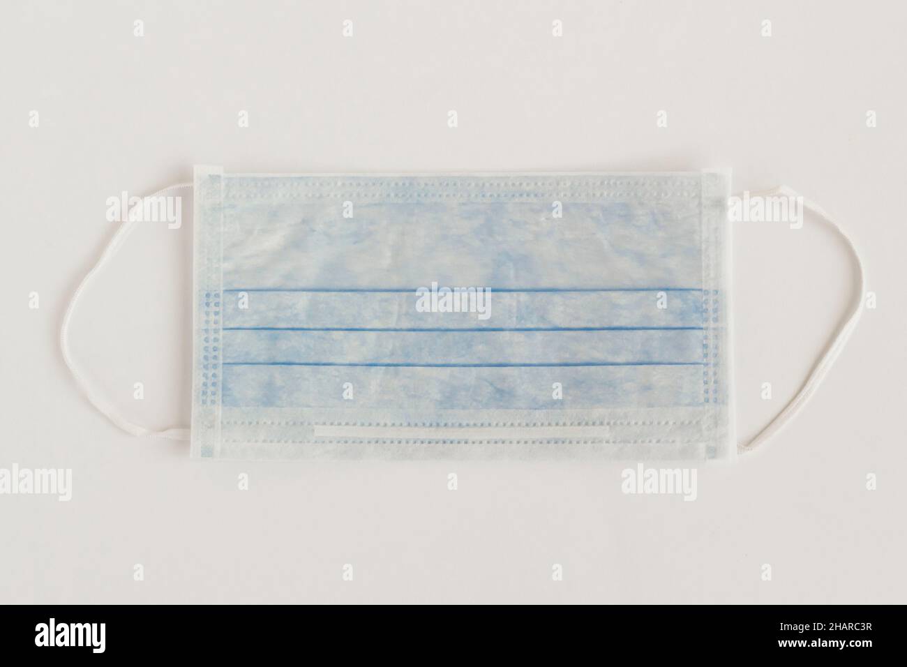 Three ply structure,single use hygenic face mask on white background with copy space. Stock Photo