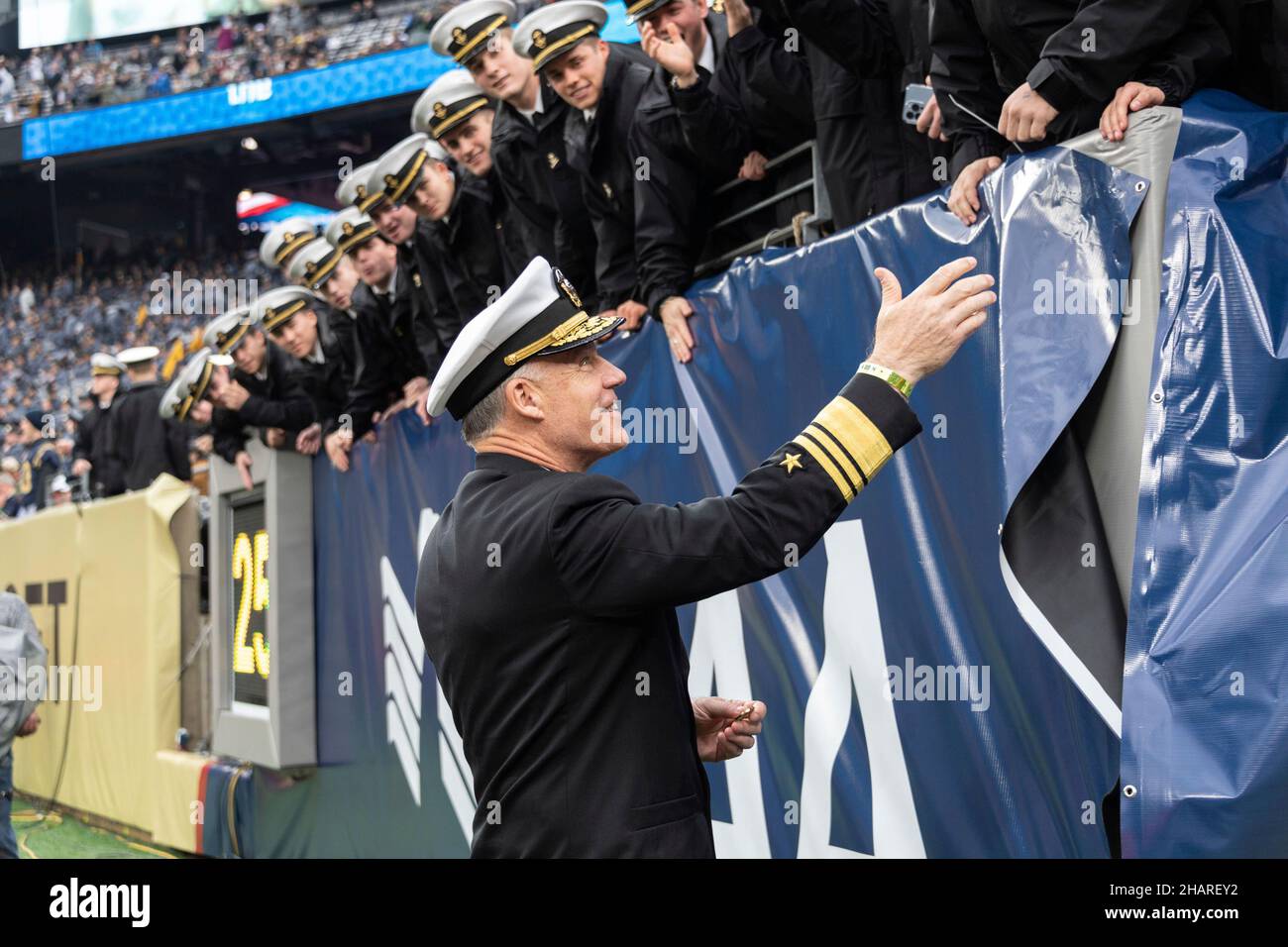 East Rutherford, United States of America. 11 December, 2021. U.S. Naval Academy superintendent, Vice Adm. Sean Buck, greets midshipman in the stands during the annual Army-Navy football game at Metlife Stadium December 11, 2021 in East Rutherford, New Jersey. The U.S. Naval Academy Midshipmen defeated the Army Black Knights 17-13 in their 122nd matchup.  Credit: Stacy Godfrey/DOD/Alamy Live News Stock Photo