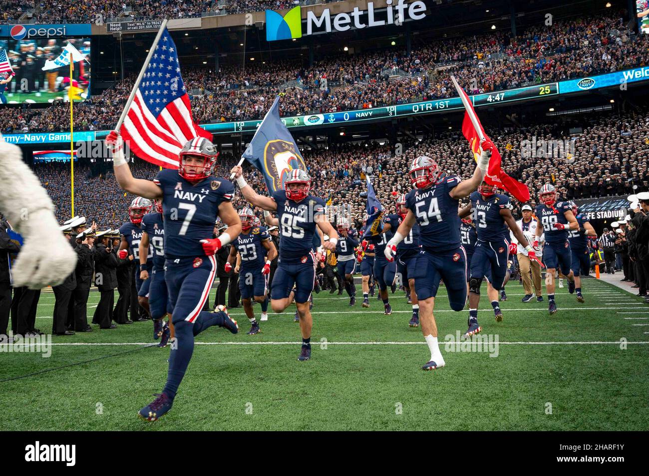 East Rutherford, United States of America. 11 December, 2021. U.S. Naval Academy quarterback Xavier Arline #7, runs on to the field at the start of the annual Army-Navy football game at Metlife Stadium December 11, 2021 in East Rutherford, New Jersey. The U.S. Naval Academy Midshipmen defeated the Army Black Knights 17-13 in their 122nd matchup.  Credit: MCC Diana Quinlan/U.S. Navy Photo/Alamy Live News Stock Photo