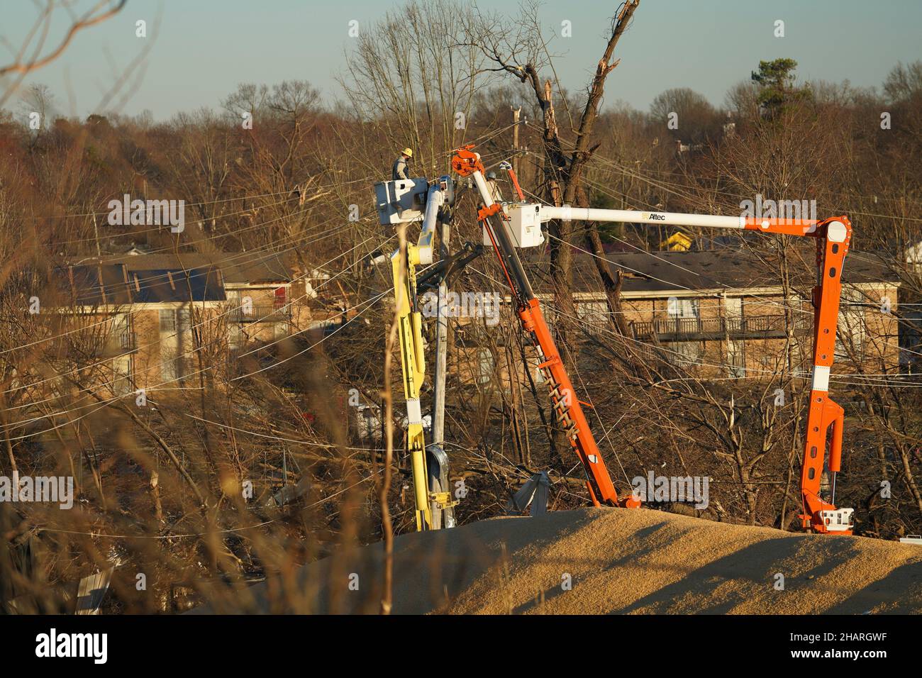 Mayfield, United States Of America. 13th Dec, 2021. Mayfield, United States of America. 13 December, 2021. Utility linesmen work on restoring power to residents the aftermath of devastating tornadoes that swept across four states destroying buildings and killing dozens December 13, 2021 in Mayfield, Kentucky. Credit: Lameen Witter/FEMA/Alamy Live News Stock Photo