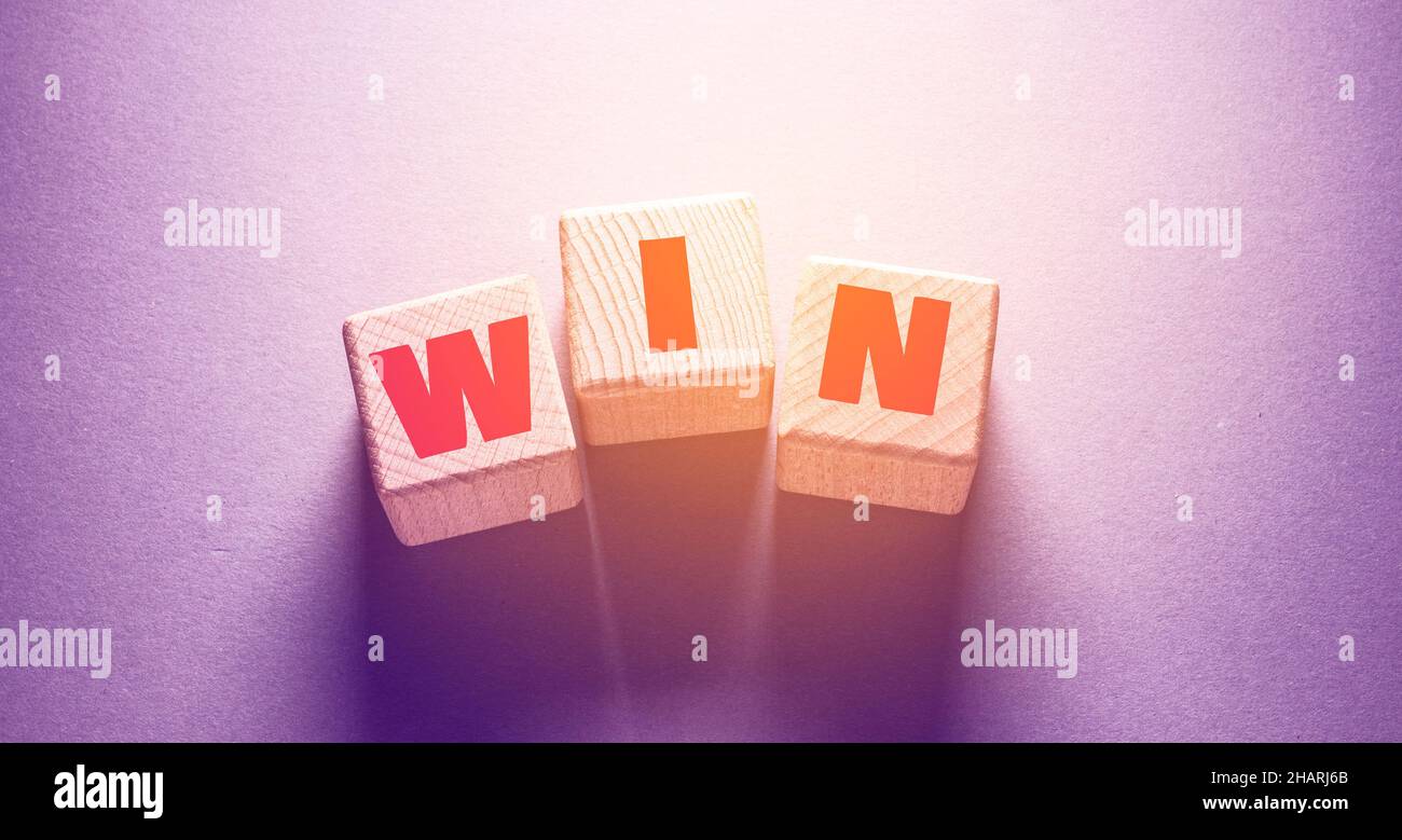 Win Word Written on Wooden Cubes Stock Photo