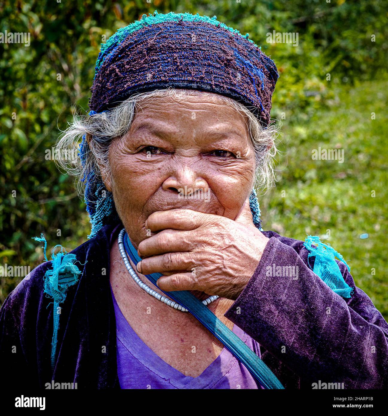 Vietnamese lady who was walking along the side of the road. Stock Photo