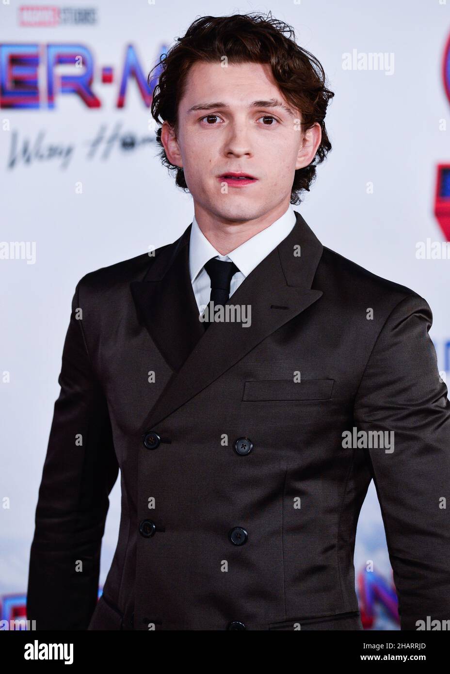Westwood, United States. 13th Dec, 2021. WESTWOOD, LOS ANGELES, CALIFORNIA,  USA - DECEMBER 13: English actor Tom Holland wearing a Prada suit and  Christian Louboutin shoes arrives at the Premiere Of Columbia