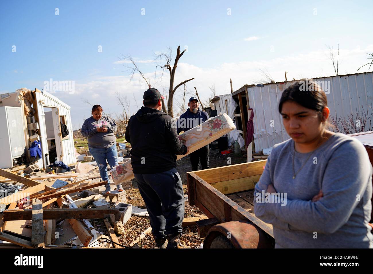 The Valero family salvage items from the rubble of what was their home