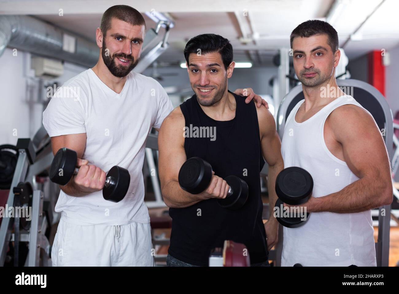 Three guys in training room Stock Photo
