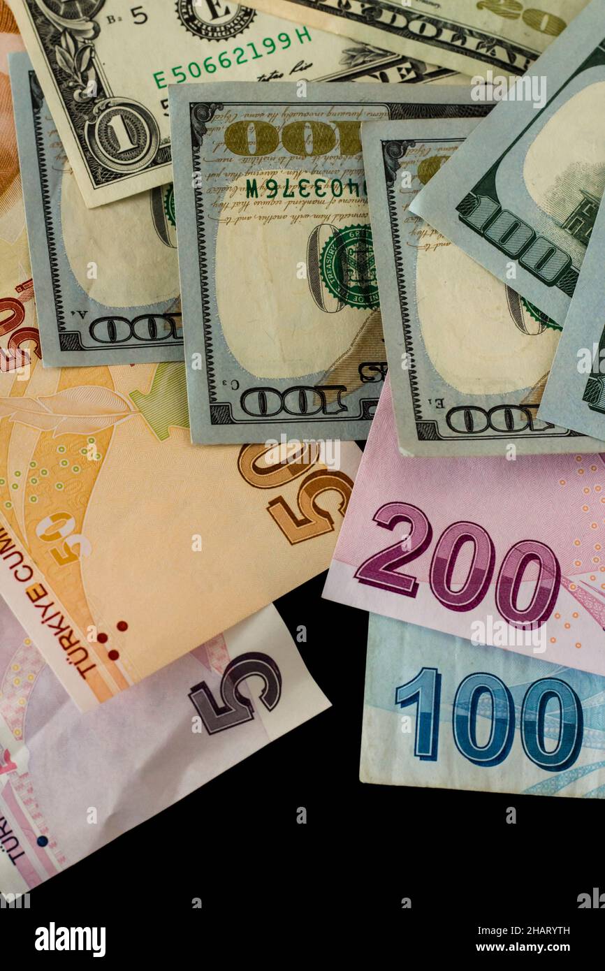 Turkish Money and American Dollar Bills on black background with copy