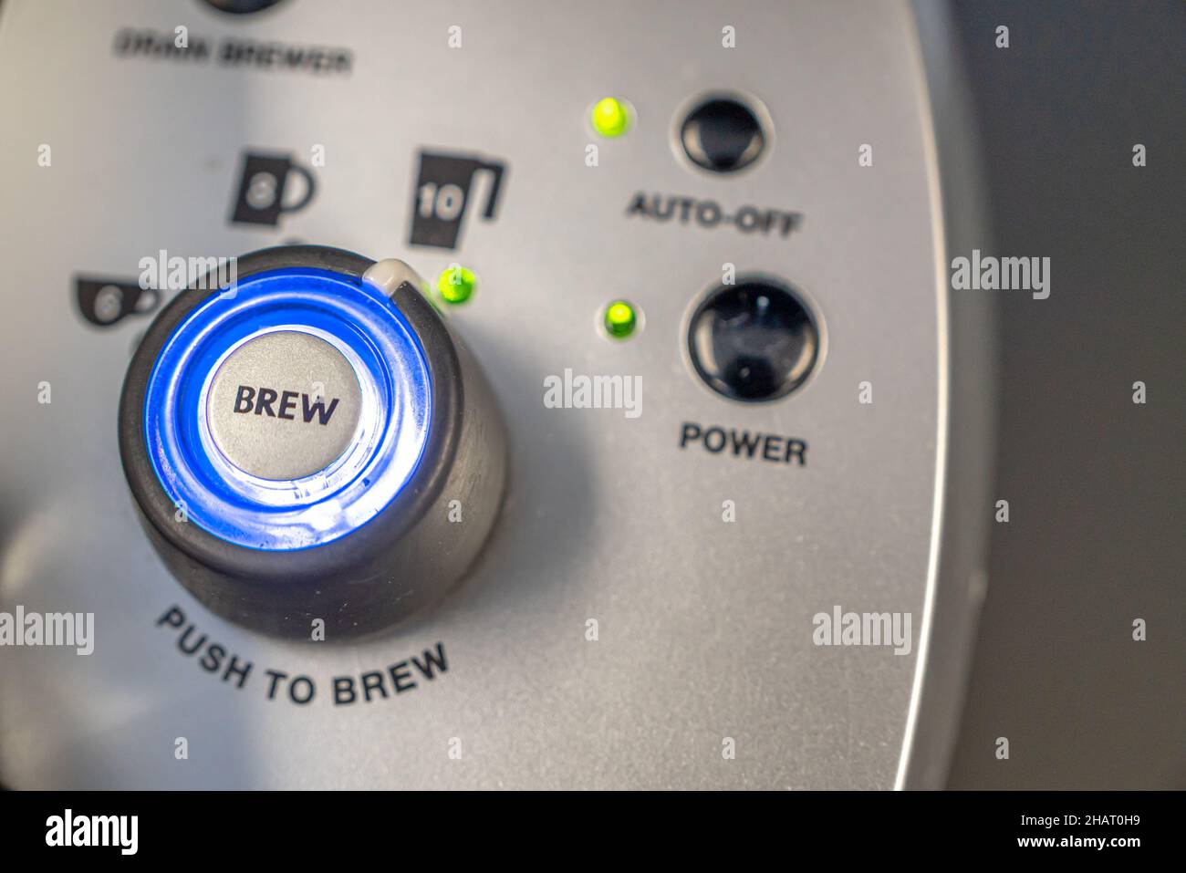 Coffee machine brew button in office tea room Stock Photo Alamy