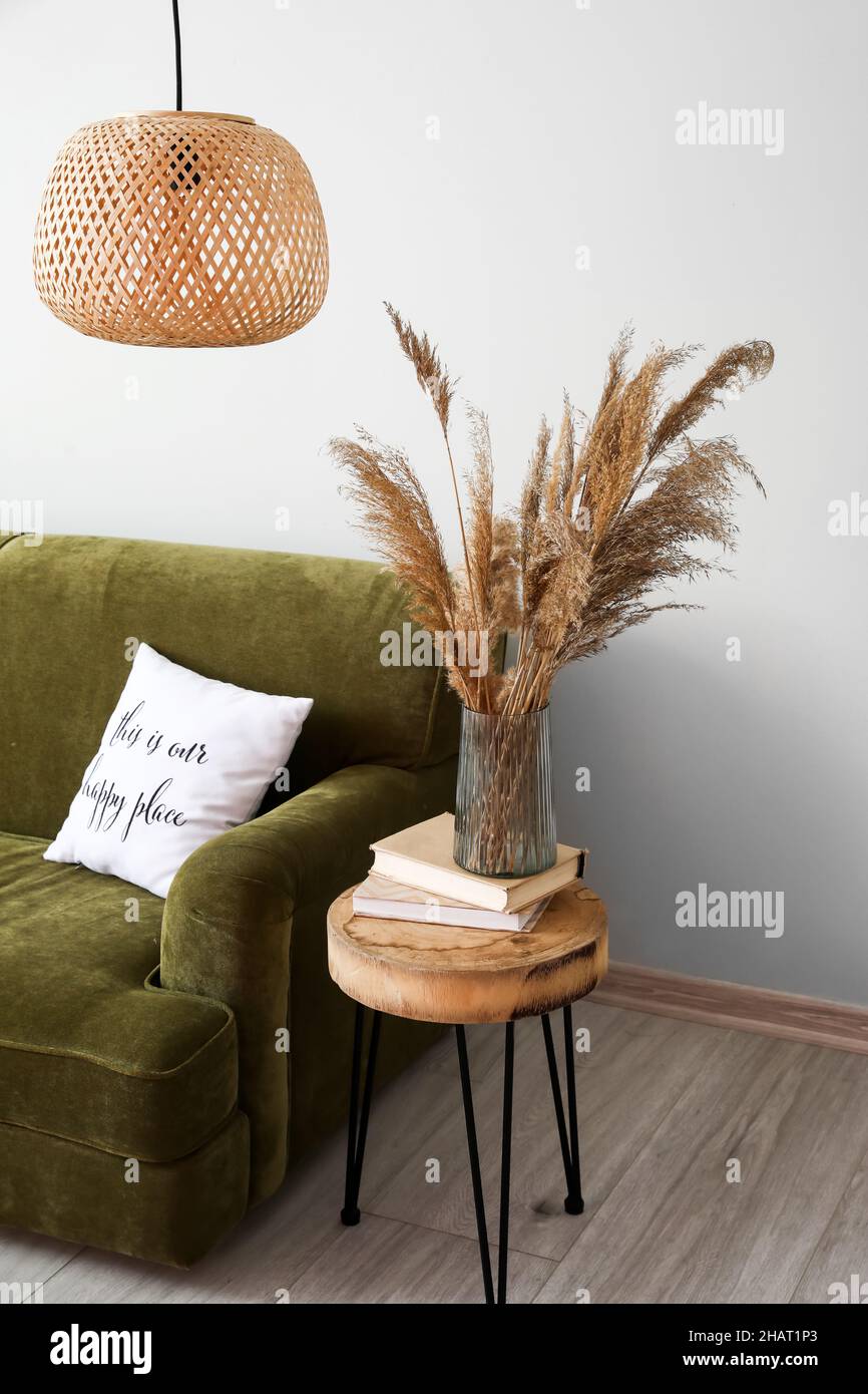 Interior of modern room with table and sofa Stock Photo - Alamy