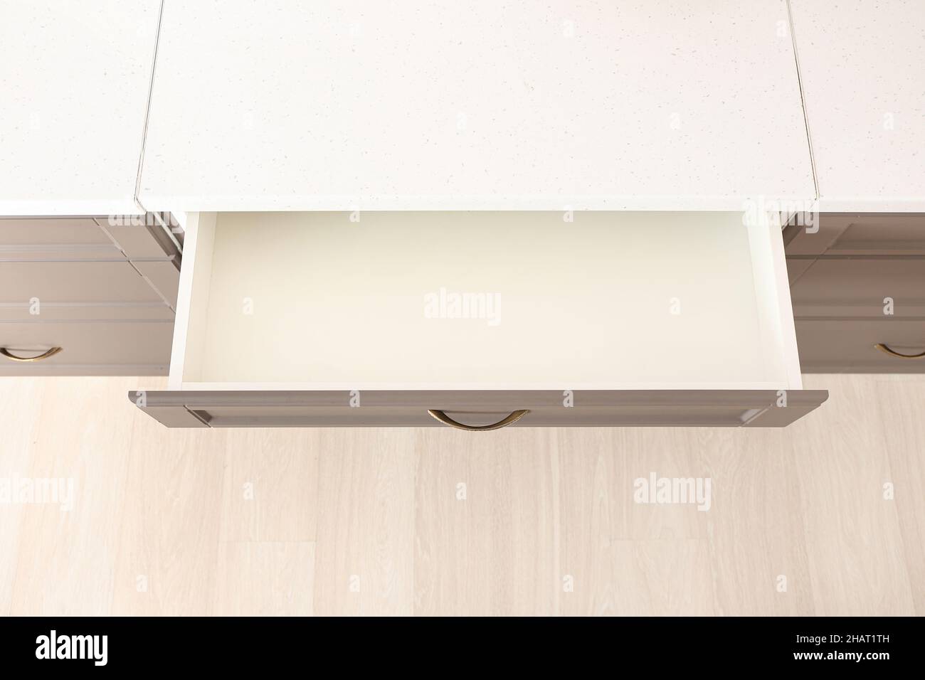 Opened kitchen drawer in room Stock Photo - Alamy