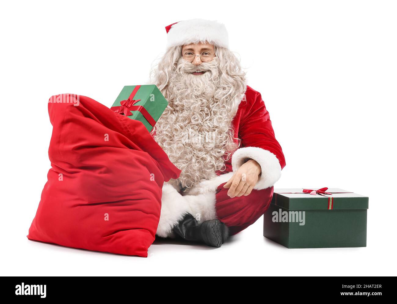 Santa Claus with gift boxes and bag on white background Stock Photo - Alamy