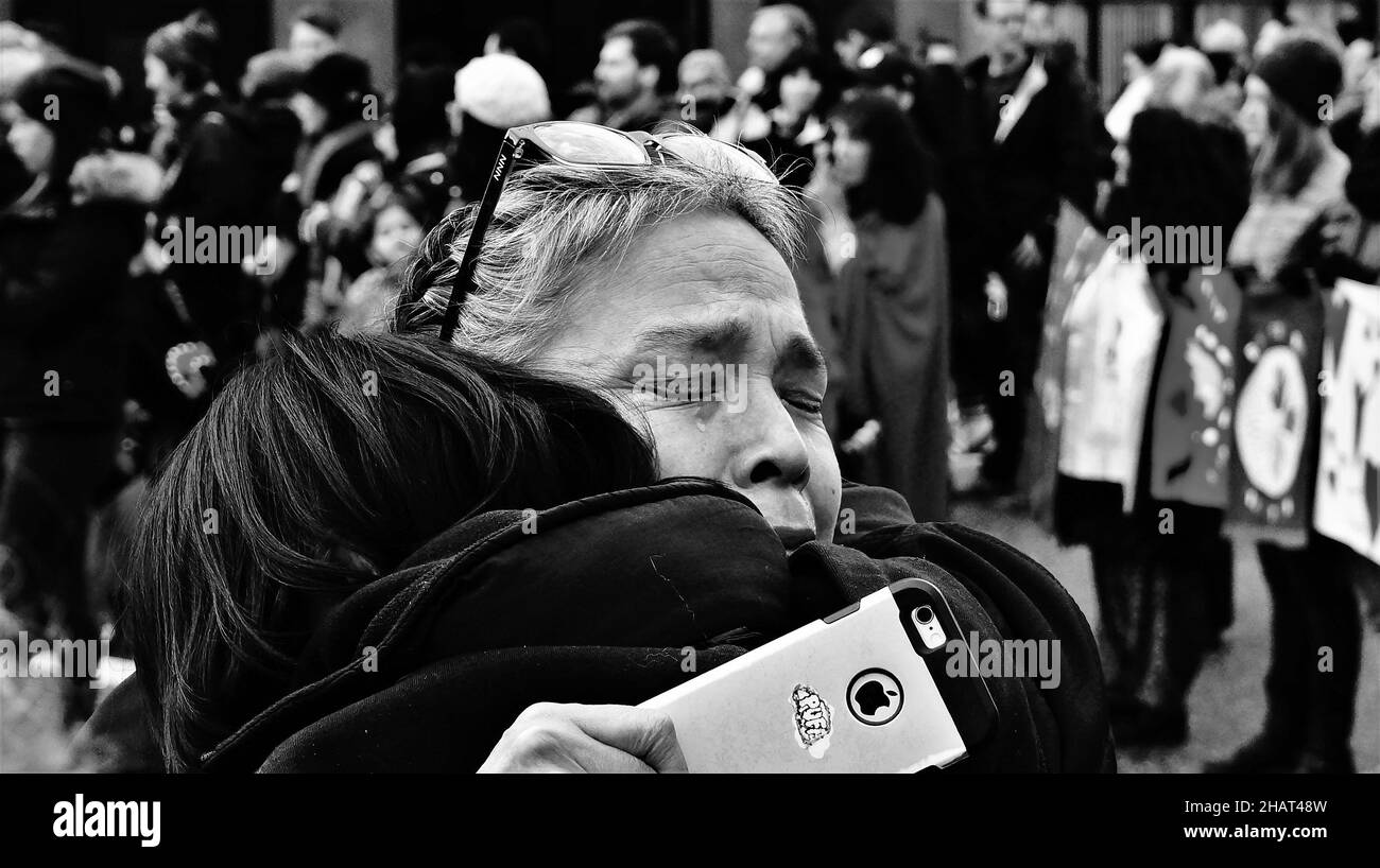 Archive - 2018. A teardrop falls down a woman's face as she is comforted by a friend during the annual Women's Memorial March in East Vancouver. Stock Photo