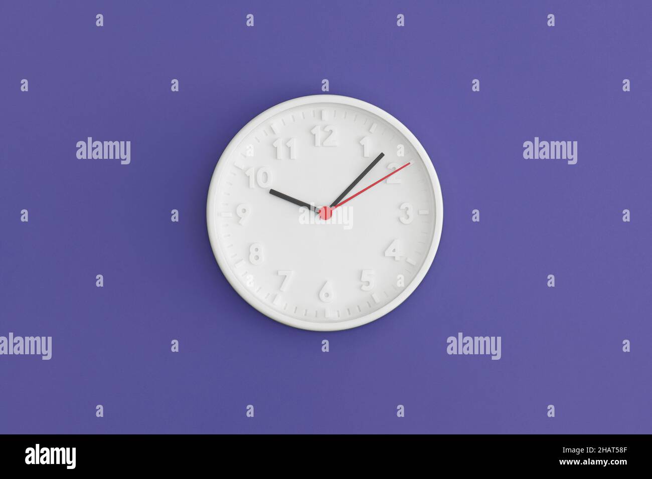 White wall Clock on gree background. Stock Photo