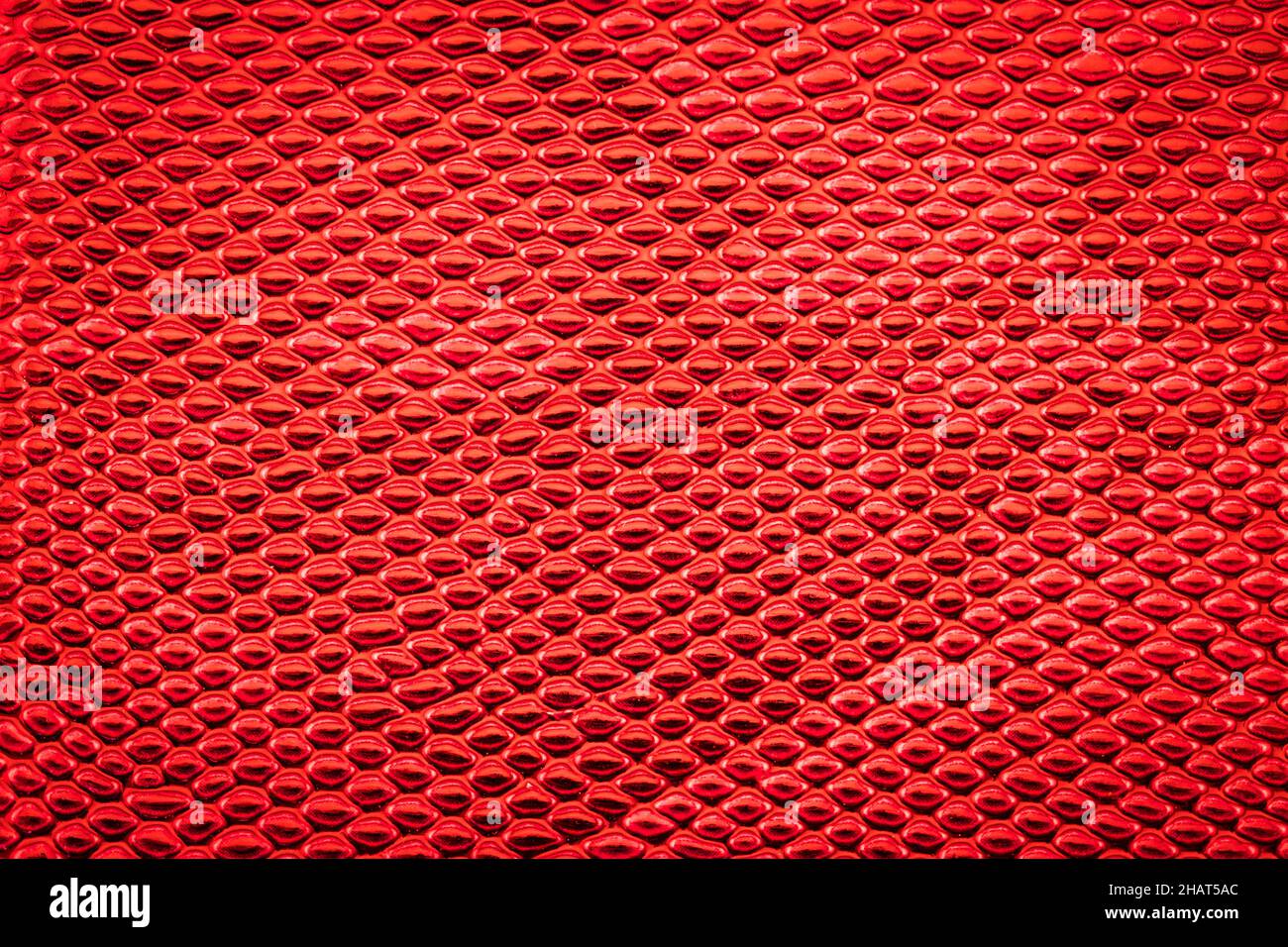 Red exotic Snake skin pattern as a wallpaper Stock Photo