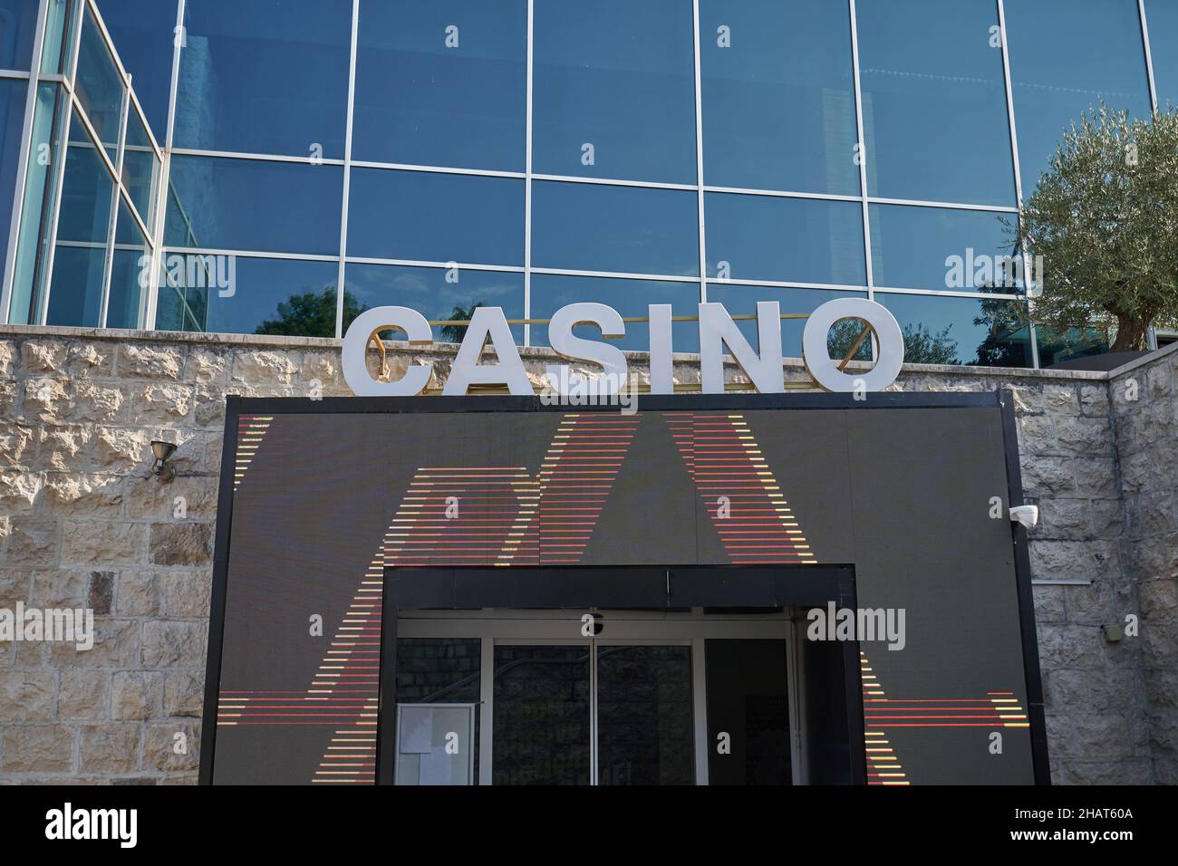 Advertising sign of the casino on the facade of the building. Stock Photo