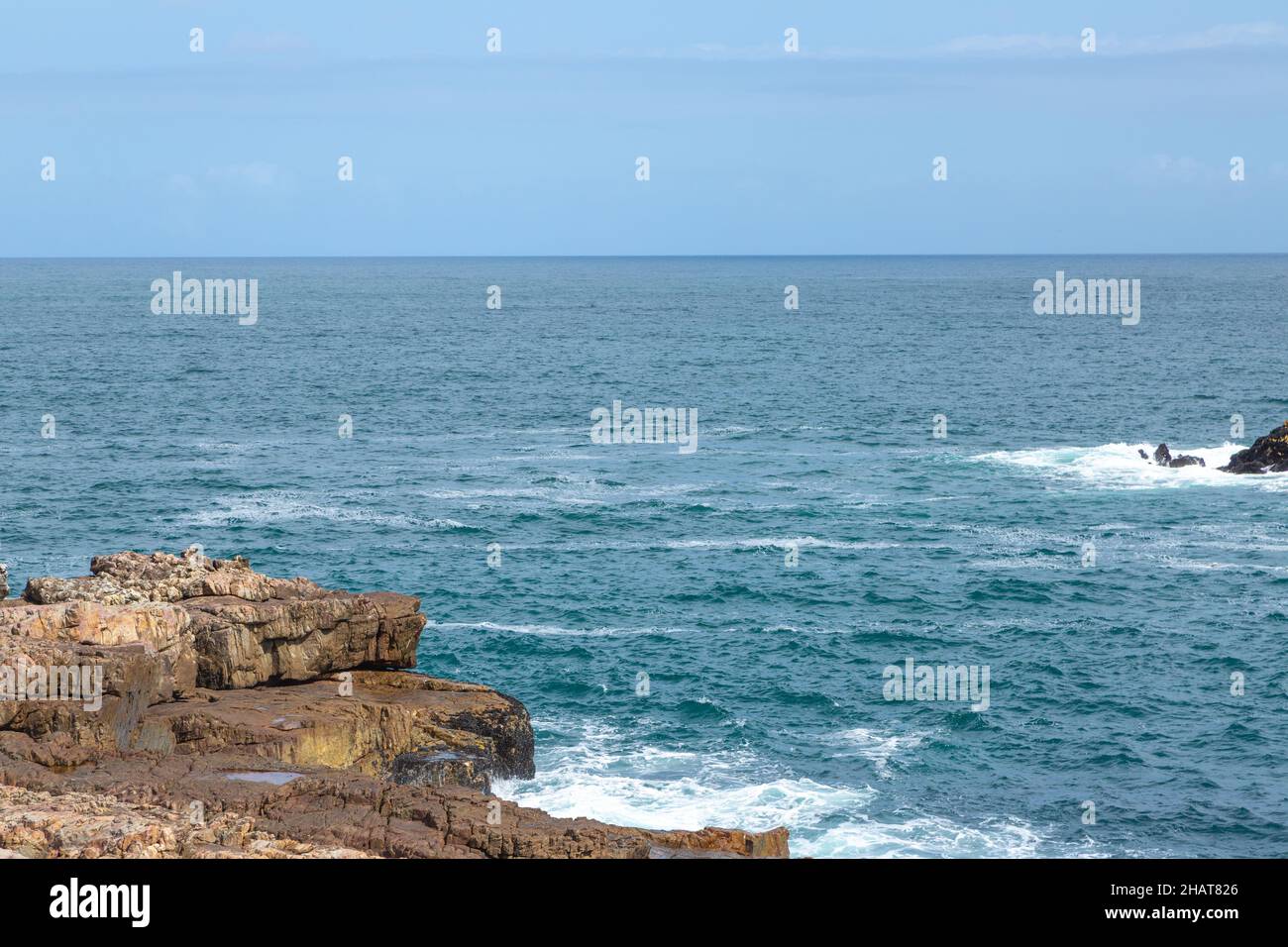 Look out on the Indian Ocean from the Cliff Path of Hermanus in the Western Cape of South Africa Stock Photo