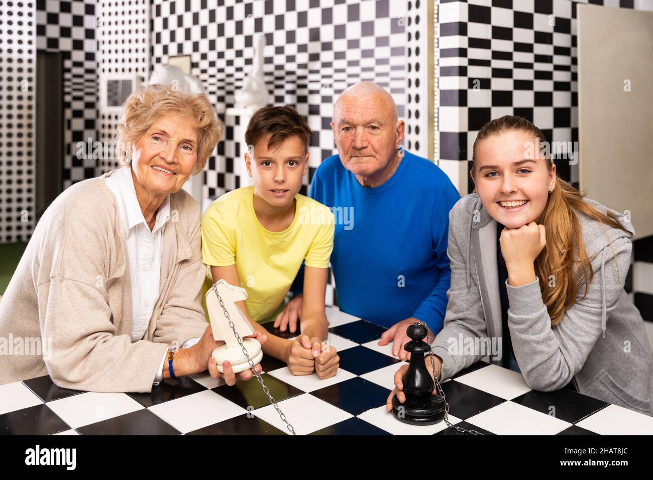 Grandkids and grandparents in escape room Stock Photo