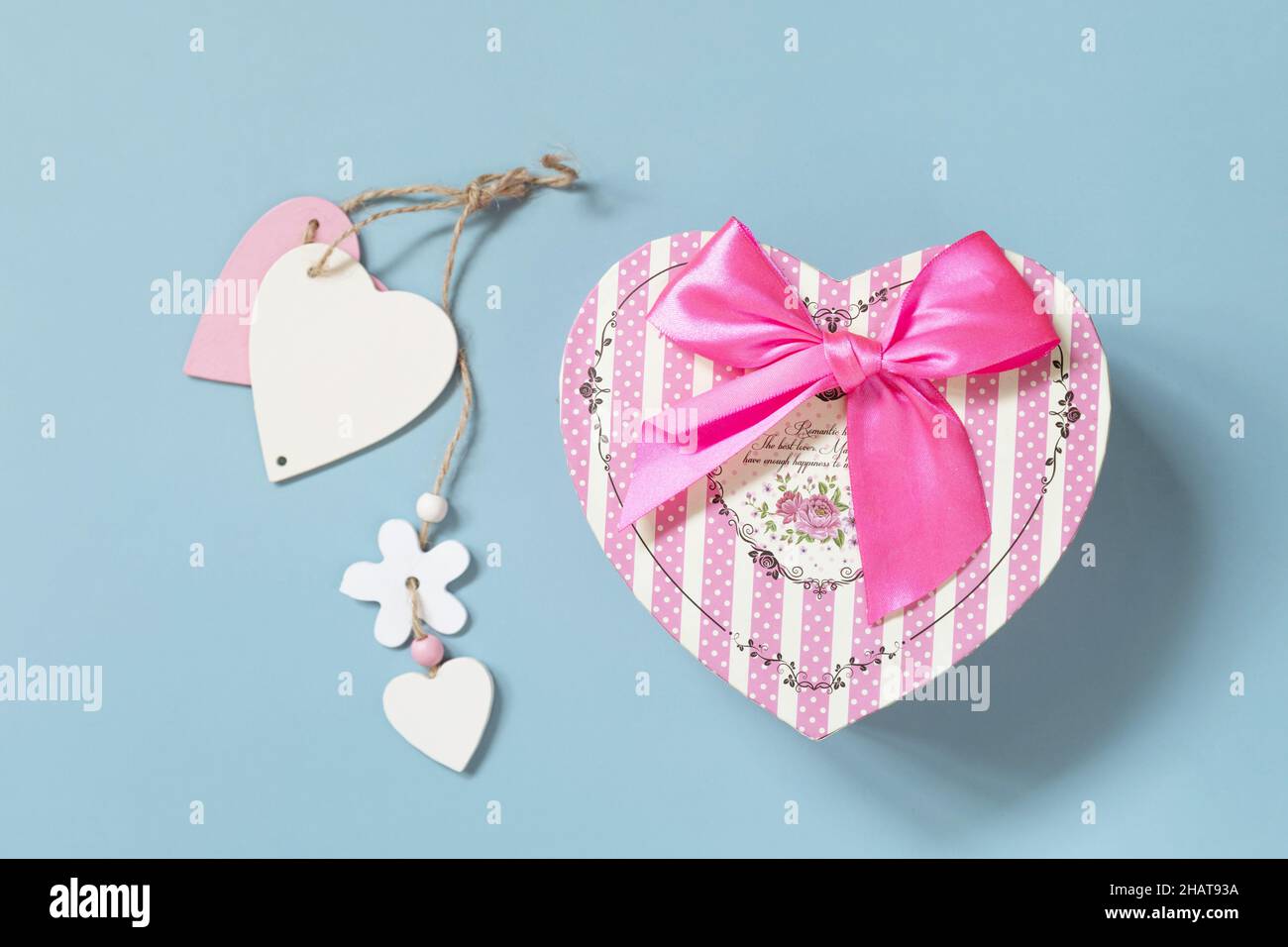 Valentine's day concept with heart gift box on a blue background, minimal layout. Top view flat lay. Stock Photo