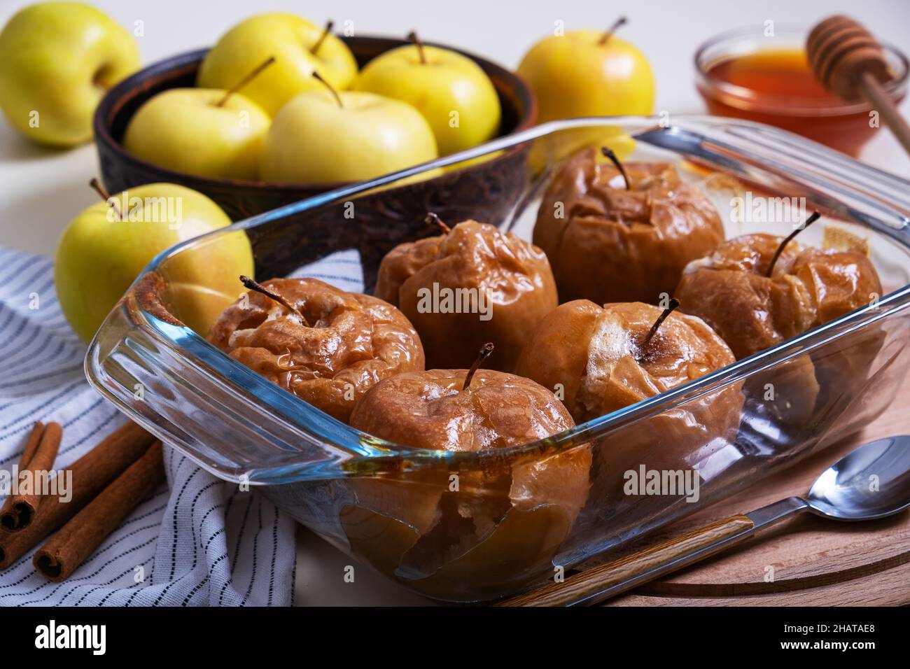 Baked caramelized apples with honey in glass refractory baking dish
