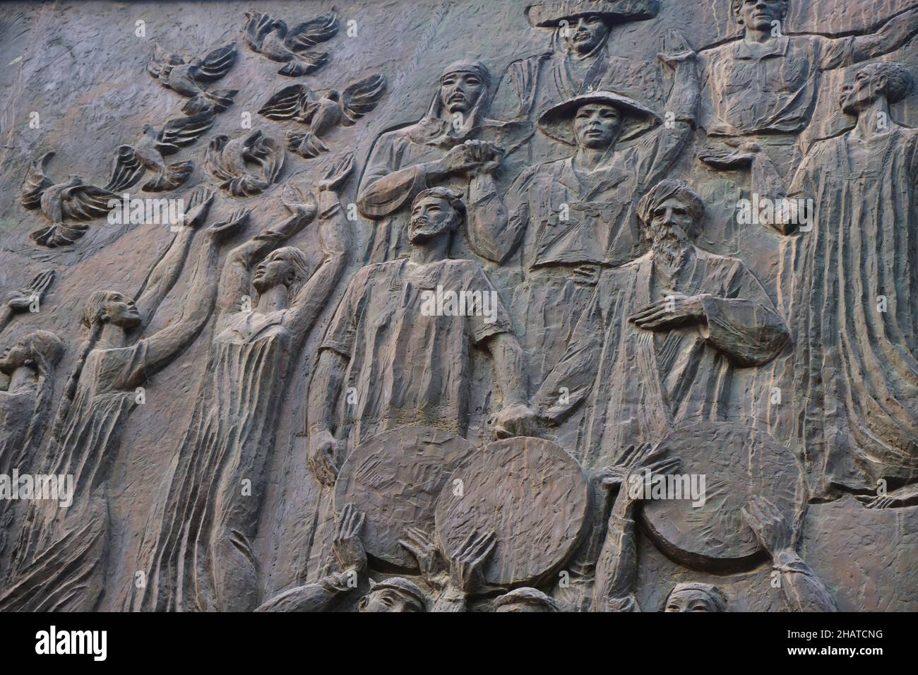 The bronze frieze Socialist artwork at the Mustakillik Maydoni metro, subway entrance. Women releasing birds.  In Tashkent, Uzbekistan. Stock Photo