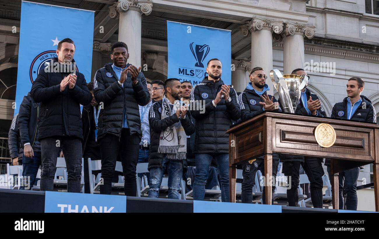 New York, USA. 14th Dec, 2021. NYCFC team stand on stage to acknowledge fans for their support during celebration for NYCFC winning the 2021 MLS Cup on City Hall steps in New York on December 14, 2021. NYCFC finished the regular season in 4th place and played almost all playoff games away. Winning the MLS Cup is the first trophy won by the franchise since it was established 7 years ago. NYCFC is part of the City Football Group which owns football clubs around the world. (Photo by Lev Radin/Sipa USA) Credit: Sipa USA/Alamy Live News Stock Photo