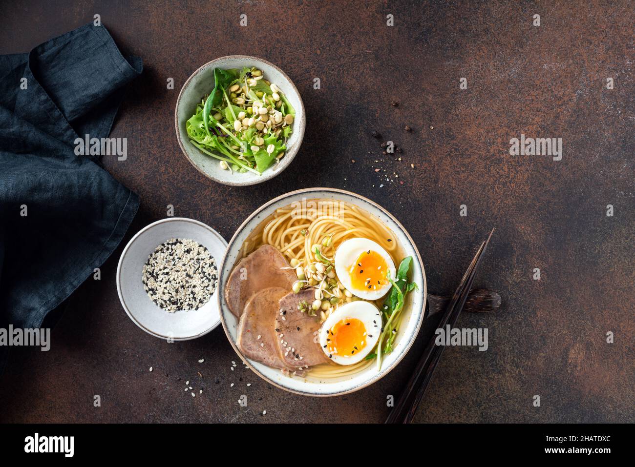 Japanese ramen noodles soup bowl with pork and egg table top view copy space Stock Photo